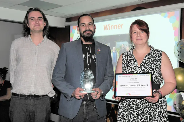 Bute Energy's James Green, left, presents the Environmental award to Josh Rawcliffe and Kelly Gulliford of Sown and Grown Allotments group