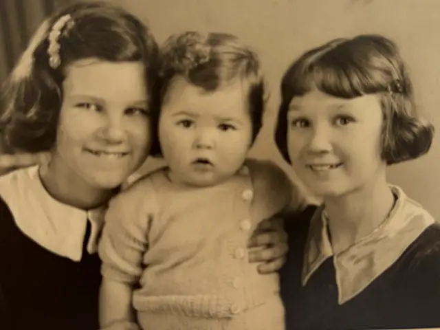 Joan aged 13, left, with half-brother Roger and sister Dorothy