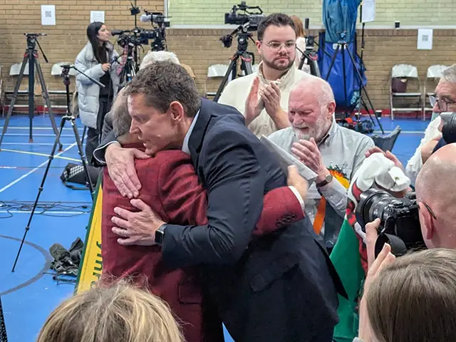 Plaid Cymru leader Rhun ap Iorwerth hugging his winning candidate Lindsay Whittle
