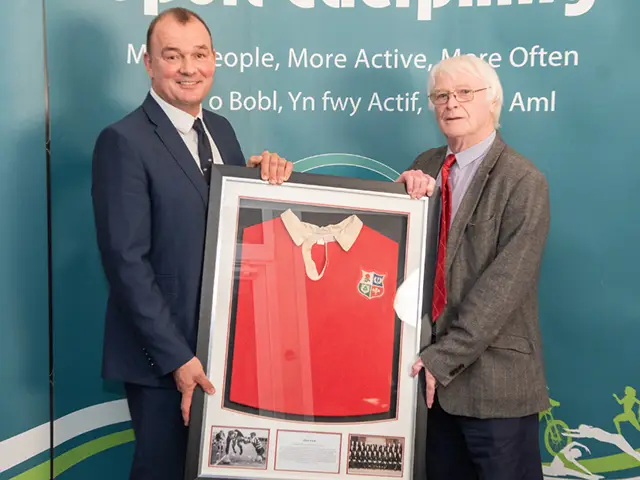 Steve Fenwick, right, presenting Alun Pask's Lions jersey to his son, Richard Pask