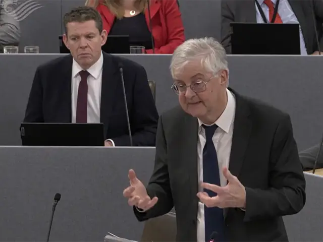 Finance secretary Mark Drakeford, right, and Plaid Cymru leader Rhun ap Iorwerth