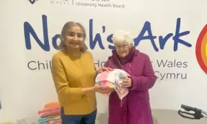 Mary Davies, right, presenting some of the blankets to Noah's Ark Children's Hospital in Cardiff