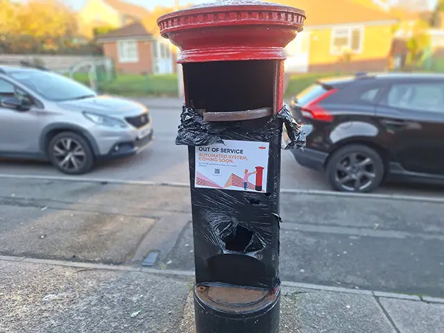 An out-of-order postbox in Penyrheol, Caerphilly, during refurbishment