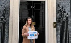 Ellie James handing in the petition to 10 Downing Street