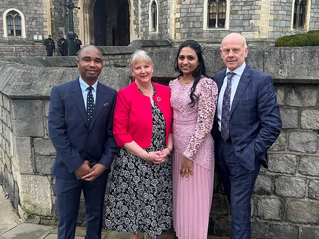 Carol Dight, second from left, at Windsor Castle alongside fellow social care workers Taura Zimbi, Shiny Skaria, and Mario Kreft MBE