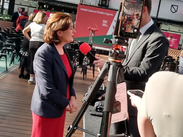 First Minister Eluned Morgan speaking to a reporter at Welsh Labour's manifesto launch