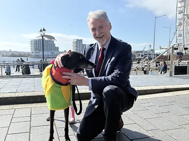 Deputy First Minister Huw Irranca-Davies with a greyhound