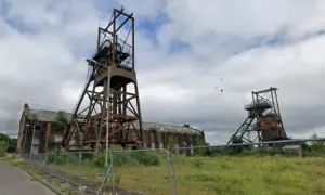 The former power hall and winding wheels at the Penallta Colliery site, pictured in June 2025