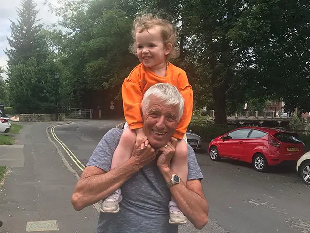 Robin and his granddaughter, Braxton