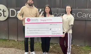 Rob's Roast founders Simon Smallwood and Steph Kelsey, and Abigail Hughes of St David's Hospice, centre