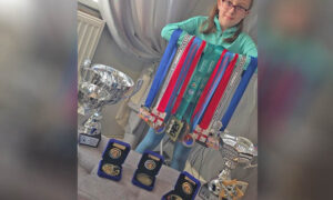 Seren Price with some of her medals and trophies
