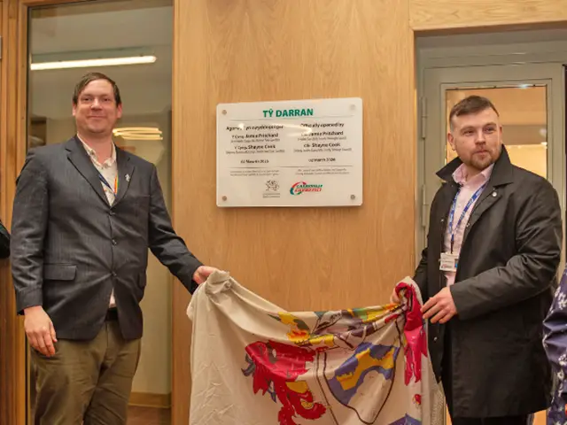 Senior councillors Jamie Pritchard, left, and Shayne Cook officially opening Ty Darran in Risca
