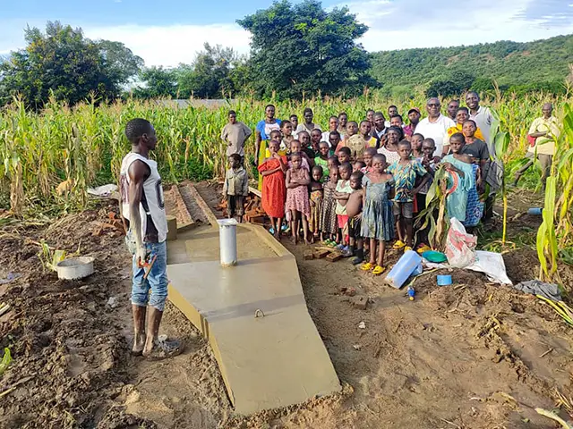 Karonga residents with their new water well
