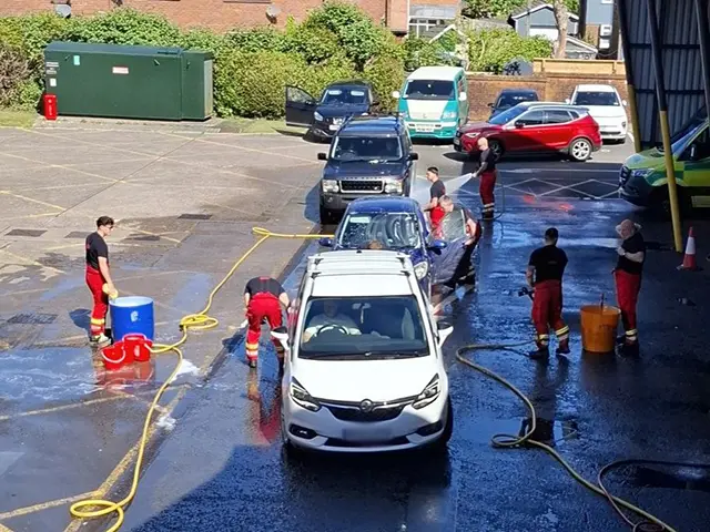 Firefighters raised &pound;820 doing a charity car wash