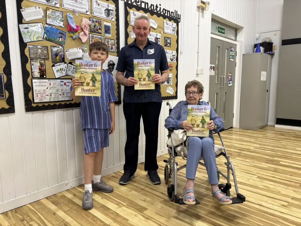 Logan Greening, Steve Davies and Pauline Kennedy with the book