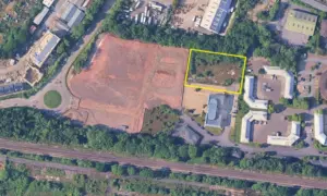 Aerial view of the proposed development site for a new padel business at Caerphilly Business Park, highlighted in yellow