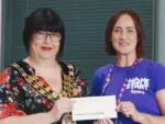 Cllr Dawn Ingram-Jones, left, presenting a cheque to Home-Start Cymru